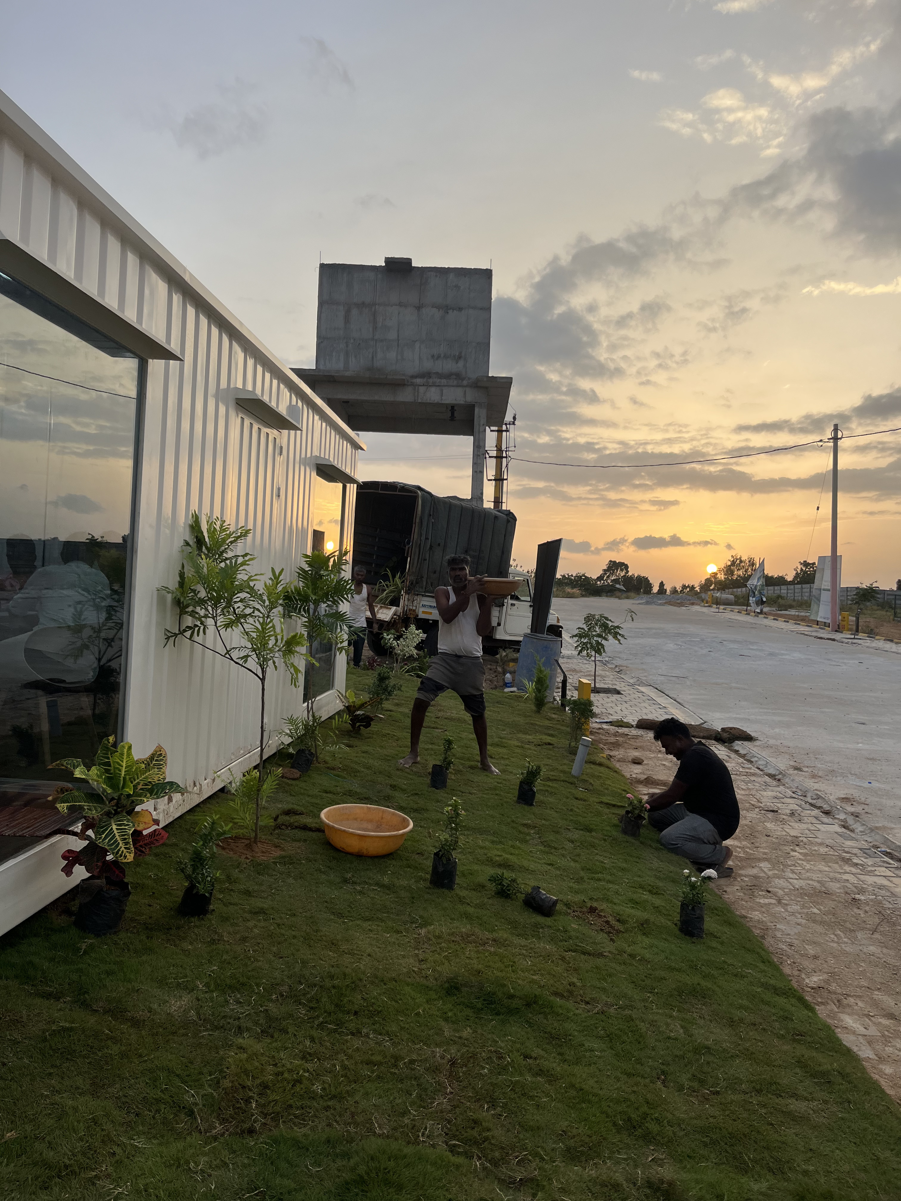 People working in the field on landscape